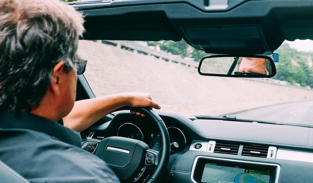 A man drive a Left Hand Car on the road
